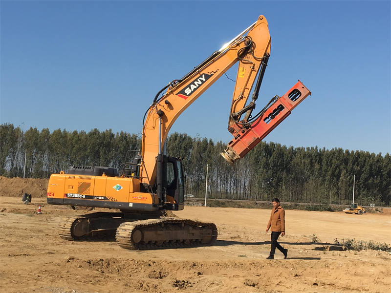 Rapid impact compaction lifted by excavator